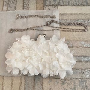 Brand new white floral clutch with silver chains